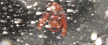 Person partly obscured by snow storm