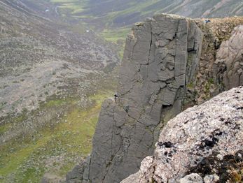 Rock climbing spot, a flat cliff in the mountains.